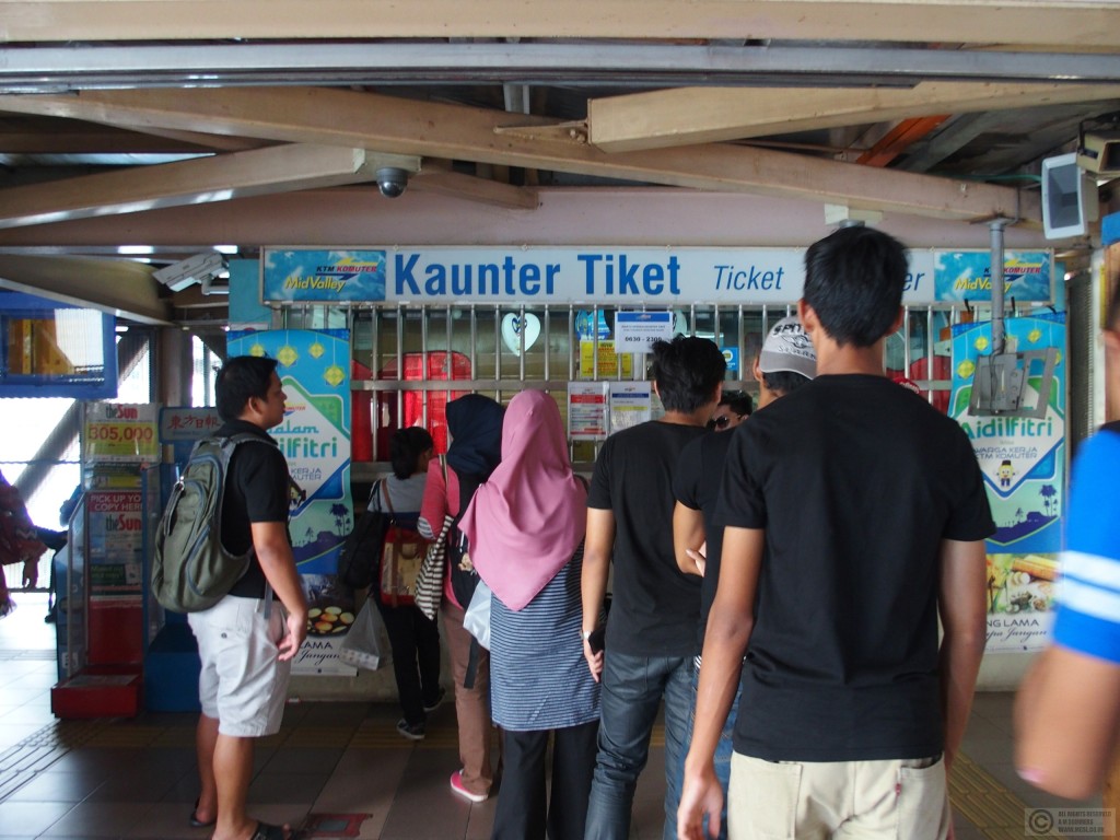 Queuing for commuter railway tickets. Malaysian can be quite easy to understand!