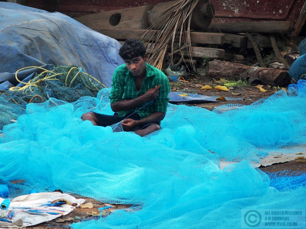 Mending nets in Chapora